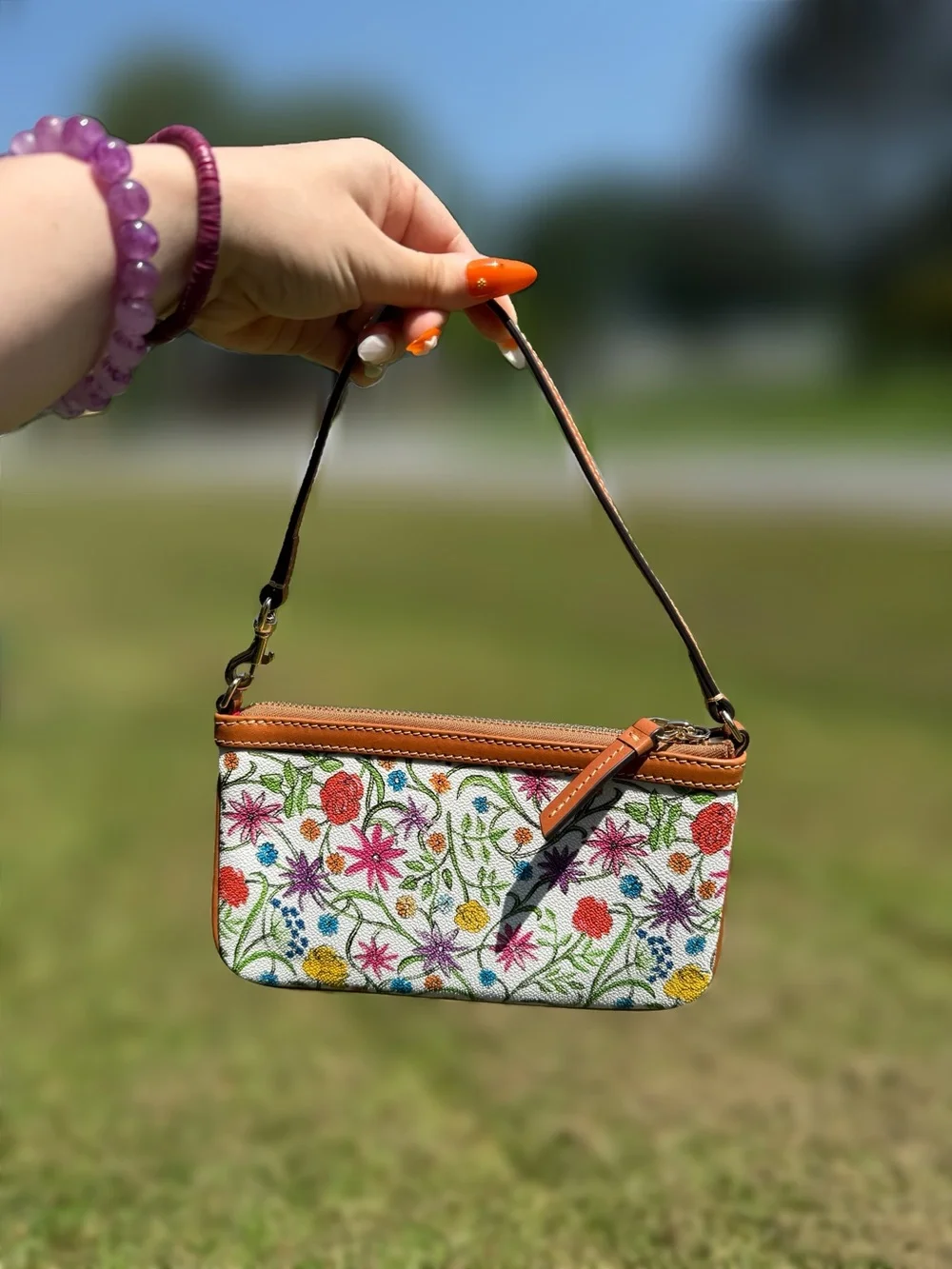Dooney & Bourke Floral Pattern Wristlet in White and Brown Trim